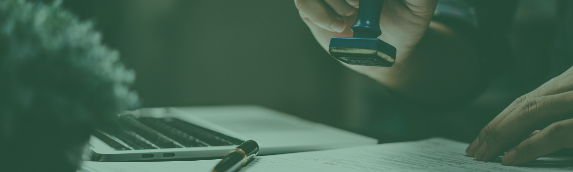 Someone stamping a page